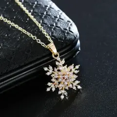 Çelik Gold Dönen Kar Tanesi Kolye